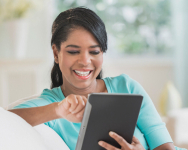 Smiling woman with a tablet
